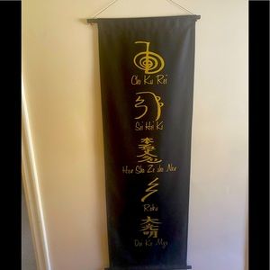 Black and Gold Tapestry. Hangs from a thick lace. Looks great in any room.